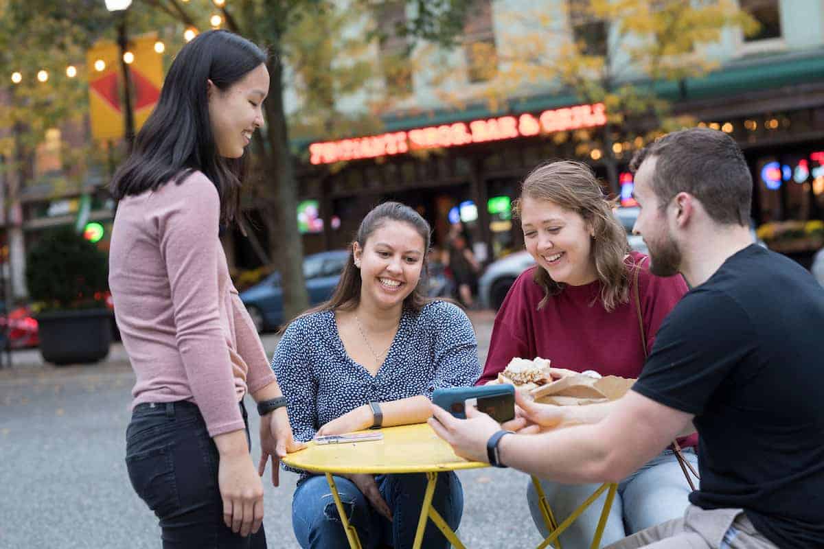 Students gather outside of primanti brothers enjoying time off campus.